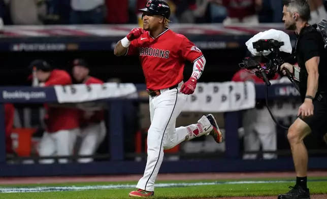 Cleveland Guardians third baseman José Ramírez celebrates after hitting a home run in the fourth inning of Game 5 of baseball's American League Division Series against the Chicago White Sox, Saturday, Oct. 10, 2026, in Cleveland. (AP Photo/Sue Ogrocki)