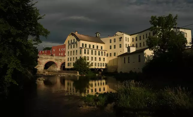Sunlight illuminates The Birkett Mills, Wednesday, Aug. 19, 2026, in Penn Yan, N.Y. (AP Photo/Joshua A. Bickel)