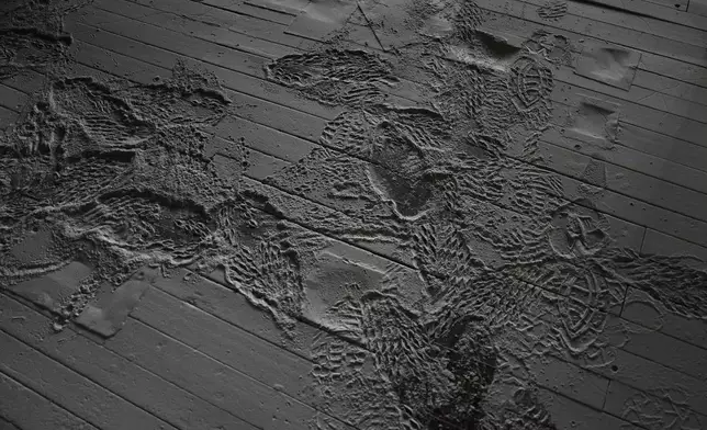Buckwheat dust and footprints cover the floor near equipment Wednesday, Aug. 19, 2026, at The Birkett Mills in Penn Yan, N.Y. (AP Photo/Joshua A. Bickel)