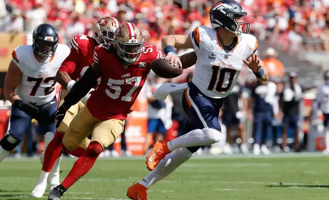 Denver Broncos quarterback Bo Nix (10) scrambles away from San Francisco 49ers linebacker Dre Greenlaw (57) during the first half of an NFL football game in Santa Clara, Calif., Sunday, Oct. 4, 2026. (AP Photo/Kelley L. Cox)