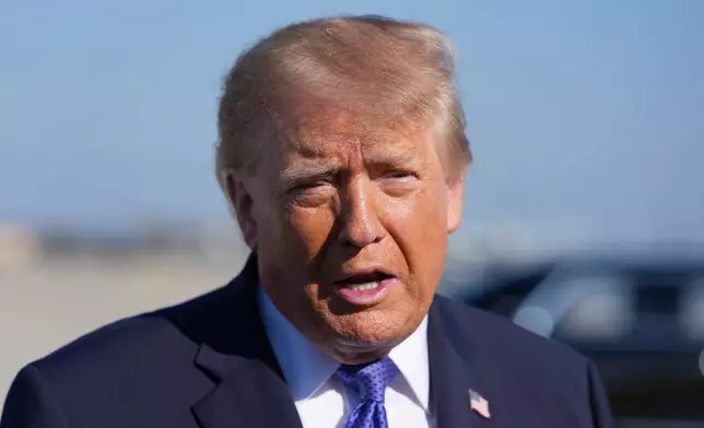 President Donald Trump speaks with reporters before boarding Air Force One, Thursday, Oct. 29, 2026, at Joint Base Andrews, Md. (AP Photo/Alex Brandon)