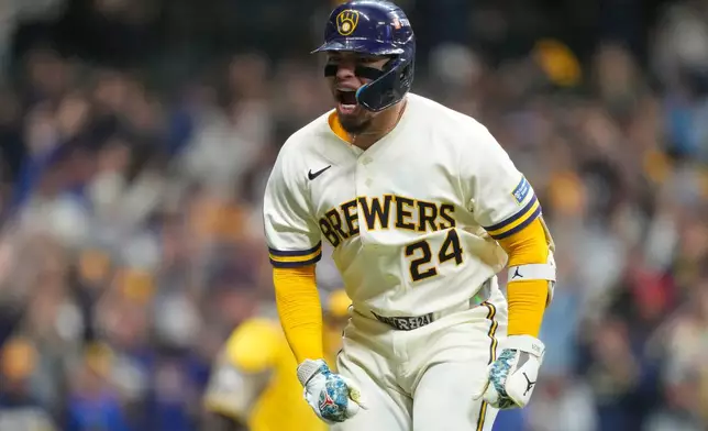 Milwaukee Brewers' William Contreras reacts after hitting a home run during the seventh inning in Game 1 of a National League Divisional baseball playoff series against the San Diego Padres Saturday, Oct. 3, 2026, in Milwaukee. (AP Photo/Kayla Wolf)