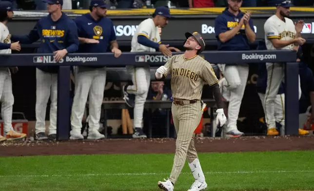 San Diego Padres' Jackson Merrill reacts after flying out during the seventh inning in Game 1 of a National League Divisional baseball playoff series against the Milwaukee Brewers Saturday, Oct. 3, 2026, in Milwaukee. (AP Photo/Chris Carlson)