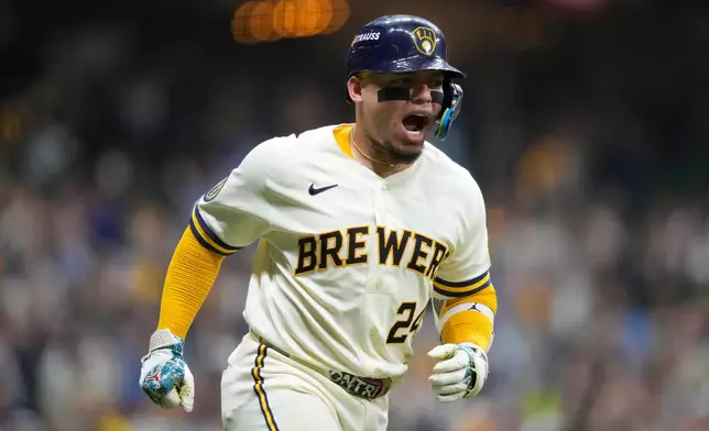 Milwaukee Brewers' William Contreras reacts after hitting a home run during the seventh inning in Game 1 of a National League Divisional baseball playoff series against the San Diego Padres Saturday, Oct. 3, 2026, in Milwaukee. (AP Photo/Kayla Wolf)