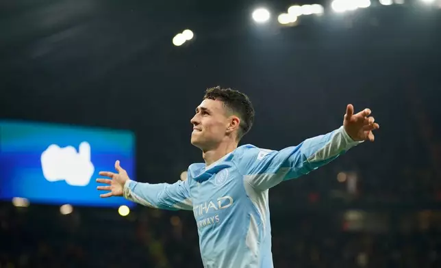 Manchester City's Phil Foden celebrates after scoring fourth goal during the Champions League soccer match between Manchester City and AEK Athens in Manchester, England, Tuesday, Oct. 20, 2026. (AP Photo/Dave Thompson)