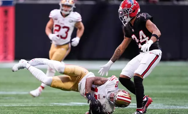 San Francisco 49ers wide receiver Jordan Watkins (17) catches a pass in front of Atlanta Falcons cornerback A.J. Terrell Jr. (24) during the second half of an NFL football game in Atlanta, Sunday, Oct. 25, 2026. (AP Photo/Brynn Anderson)