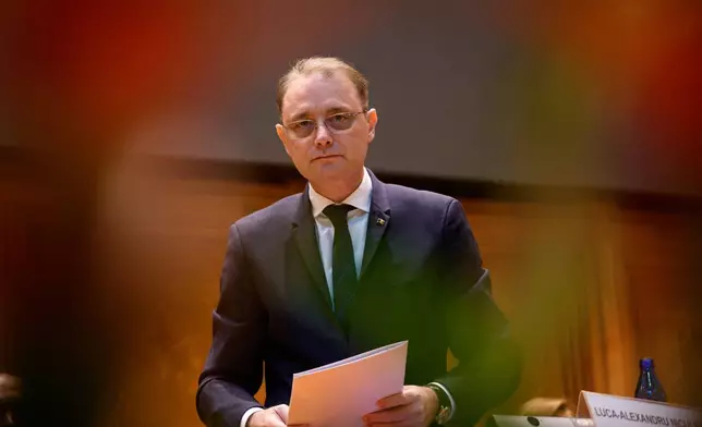 Romanian Prime Minister designate Luca Niculescu attends for a joint parliament session called to give a vote of confidence for the new government team, in Bucharest, Romania, Tuesday, Oct. 20, 2026. (AP Photo/Andreea Alexandru)