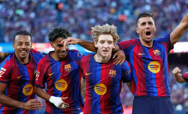 From left, Barcelona's Jules Kounde, Barcelona's Lamine Yamal, Barcelona's Anthony Gordon, Barcelona's Rodrigo celebrate after scoring during the Spanish La Liga soccer match between Barcelona and Getafe in Barcelona, Spain, Saturday, Oct. 10, 2026. (AP Photo/Joan Monfort)