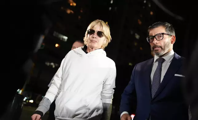 Selma Blair leaves court on Monday, Oct. 12, 2026, in New York after her arraignment on charges of injuring two flight attendants during a cross-country flight. (AP Photo/Ryan Murphy)