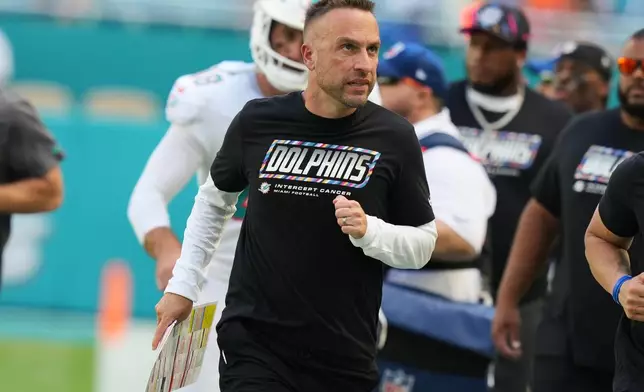 Miami Dolphins head coach Jeff Hafley leaves the field at the end of the first half during an NFL football game against the Cincinnati Bengals in Miami Gardens, Fla., Sunday, Oct. 11, 2026. (AP Photo/Lynne Sladky)
