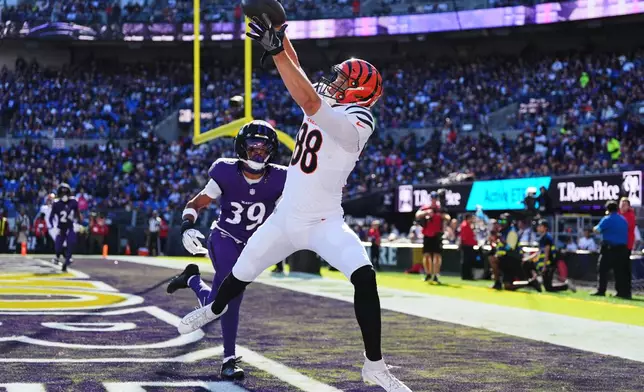 Cincinnati Bengals tight end Mike Gesicki (88) scores a touchdown during the second half of an NFL football game against the Baltimore Ravens in Baltimore, Sunday, Oct. 25, 2026. (AP Photo/Stephanie Scarbrough)