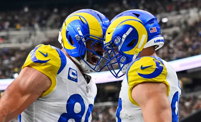 Los Angeles Rams tight end Davis Allen, right, celebrates his touchdown with teammate Tyler Higbee, left, during the first half of an NFL football game against the Las Vegas Raiders Sunday, Oct. 25, 2026, in Las Vegas. (AP Photo/David Becker)
