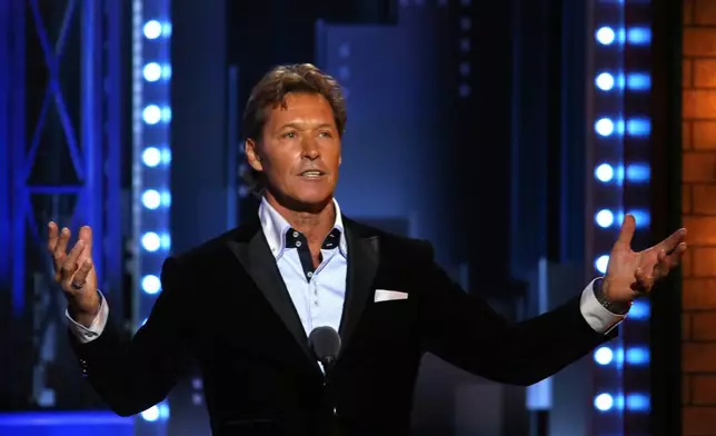 FILE - Former New York Ranger Ron Duguay introduces a performance by the cast of "Come From Away" at the 71st annual Tony Awards on Sunday, June 11, 2017, in New York. (Photo by Michael Zorn/Invision/AP, File)