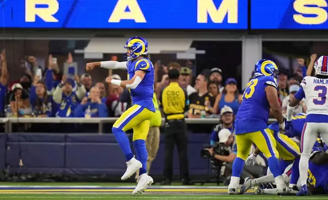 Los Angeles Rams quarterback Matthew Stafford celebrates a touchdown during the second half of an NFL football game against the Buffalo Bills, Monday, Oct. 12, 2026, in Inglewood, Calif. (AP Photo/Gregory Bull)