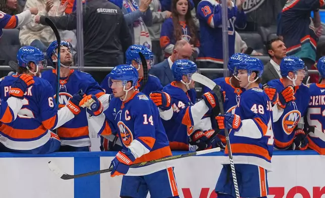New York Islanders goaltender Ilya Sorokin (30) stops a shot by Chicago Blackhawks' Frank Nazar (91) during the first period of an NHL hockey game Thursday, Oct. 8, 2026, in Elmont, N.Y. (AP Photo/Frank Franklin II)