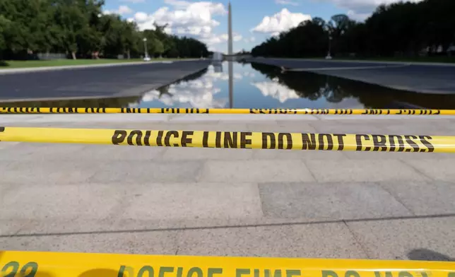 FILE - The Lincoln Memorial Reflecting Pool is seen with police line yellow tape at the National Mall, Sept. 6, 2026, in Washington. (AP Photo/Jose Luis Magana, File)