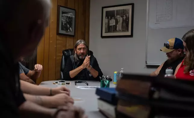 Chris Blizard, president of UAW Local 402, center, speaks during a UAW Local 402 board meeting at the union hall in Springfield, Ohio, Wednesday, Sept. 30, 2026, old Navistar's last day at its Springfield plant. (AP Photo/Carolyn Kaster)