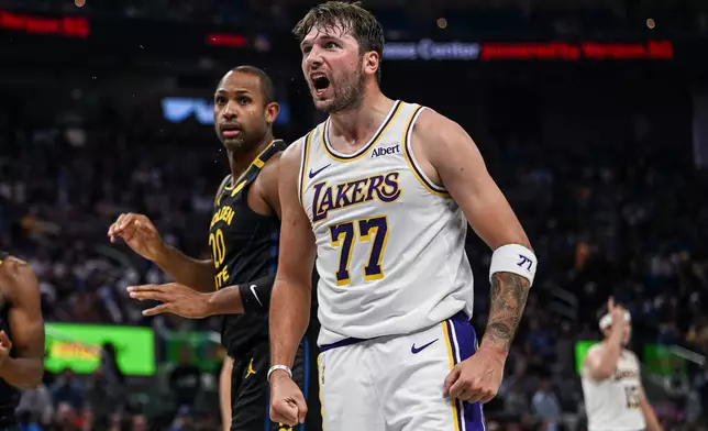 Los Angeles Lakers guard Luka Doncic (77) reacts during the first half of an NBA Cup basketball game against the Golden State Warriors, Saturday, Oct. 30, 2026, in San Francisco. (AP Photo/Justine Willard)