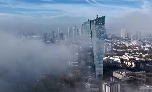 Fog drifts by the European Central Bank on the occasion of the announcement of the resignation of European Central Bank President Christine Lagarde, in Frankfurt, Germany, Thursday, Oct. 29, 2026. (AP Photo/Michael Probst)