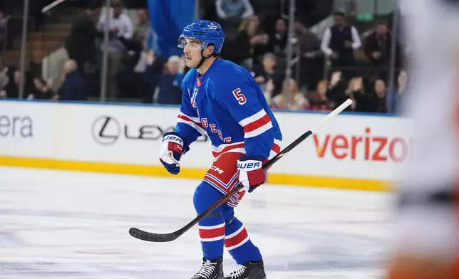 New York Rangers' Sean Durzi (5) skates toward his bench after scoring a goal during the first period of an NHL hockey game against the Anaheim Ducks Monday, Oct. 19, 2026, in New York. (AP Photo/Frank Franklin II)