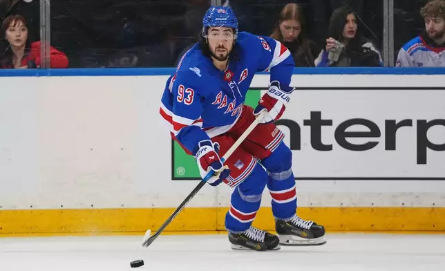 New York Rangers' Mika Zibanejad (93) looks to pass during the second period of an NHL hockey game against the Anaheim Ducks Monday, Oct. 19, 2026, in New York. (AP Photo/Frank Franklin II)