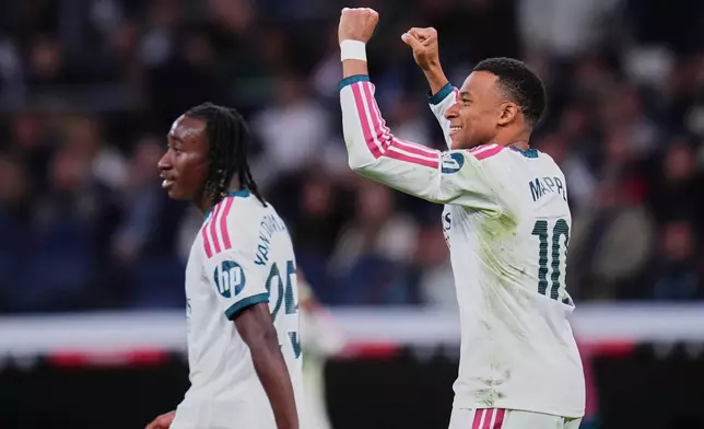 Real Madrid's Kylian Mbappe celebrates after scoring third goal during the La Liga soccer match between Real Madrid and Sevilla in Madrid, Spain, Sunday, Oct. 18, 2026. (AP Photo/Manu Fernandez)