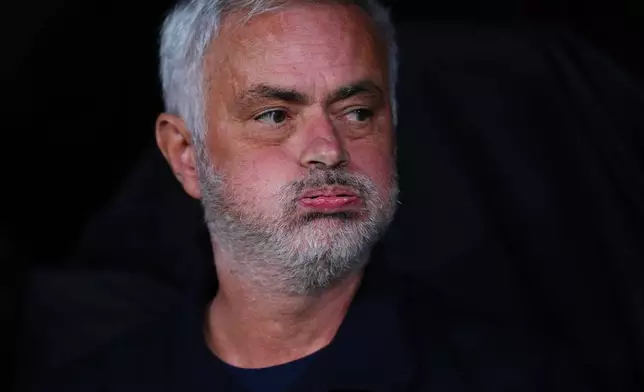 Real Madrid's head coach Jose Mourinho sits on the bench before the La Liga soccer match between Real Madrid and Sevilla in Madrid, Spain, Sunday, Oct. 18, 2026. (AP Photo/Manu Fernandez)