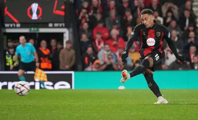 Bournemouth's Marcus Tavernier scores their second goal from a penalty kick during the Europa League soccer match between Bournemouth and AC Milan in Bournemouth, England, Thursday, Oct. 22, 2026. (AP Photo/Alastair Grant)