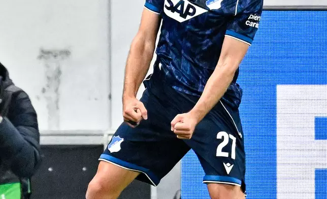 Hoffenheim's Andrej Kramaric celebrates scoring their first goal during the Europa League opening phase soccer match between TSG 1899 Hoffenheim and Olympique Lyon, Thursday, Oct. 22, 2026, in Sinsheim, Germany. (Uwe Anspach/dpa via AP)