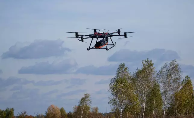 The SkyGate drone, made by the SkyFall drone company and equipped with a medical module, flies during a demonstration at an undisclosed location in Ukraine, Wednesday, Oct. 14, 2026. (AP Photo/Evgeniy Maloletka)