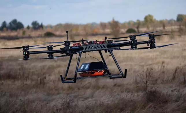 The SkyGate drone, made by the SkyFall drone company and equipped with a medical module, flies during a demonstration at an undisclosed location in Ukraine, Wednesday, Oct. 14, 2026. (AP Photo/Evgeniy Maloletka)