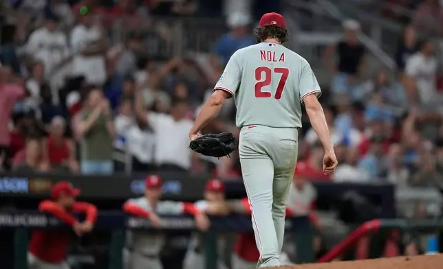 Philadelphia Phillies pitcher Aaron Nola is pulled against the Atlanta Braves in the second inning during Game 3 of baseball's NL Wild Card Series, Thursday, Oct. 1, 2026, in Atlanta. (AP Photo/Brynn Anderson)