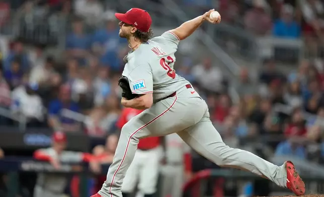 Philadelphia Phillies pitcher Aaron Nola throws against the Atlanta Braves in the first inning during Game 3 of baseball's NL Wild Card Series, Thursday, Oct. 1, 2026, in Atlanta. (AP Photo/Brynn Anderson)
