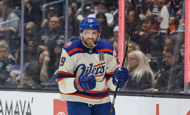 Edmonton Oilers center Leon Draisaitl (29) reacts after scoring against the Los Angeles Kings during the first period of an NHL hockey game Tuesday, Oct. 13, 2026, in Los Angeles. (AP Photo/Caroline Brehman)
