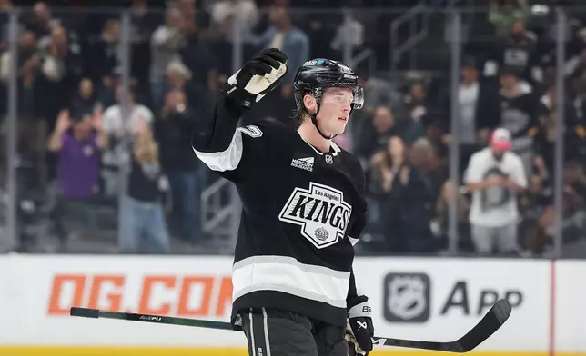 Los Angeles Kings defenseman Brandt Clarke (92) reacts after scoring against the Edmonton Oilers during the second period of an NHL hockey game Tuesday, Oct. 13, 2026, in Los Angeles. (AP Photo/Caroline Brehman)