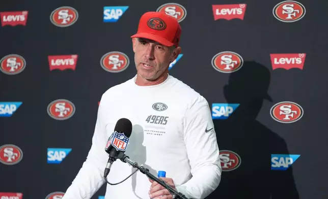 San Francisco 49ers head coach Kyle Shanahan speaks to reporters following an NFL football game against the Seattle Seahawks, Sunday, Oct. 11, 2026, in Seattle. (AP Photo/Lindsey Wasson)