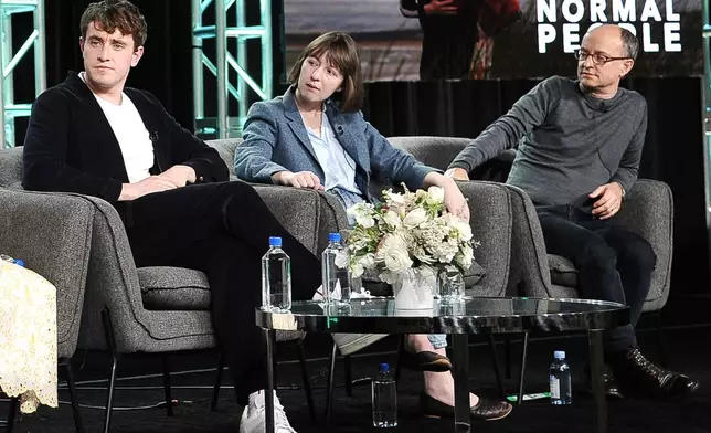 FILE - From left, Paul Mescal, Sally Rooney and Ed Guiney participate in Hulu's "Normal People" panel during the Winter 2020 Television Critics Association Press Tour on Jan. 17, 2020, in Pasadena, Calif. (Photo by Richard Shotwell/Invision/AP, File)
