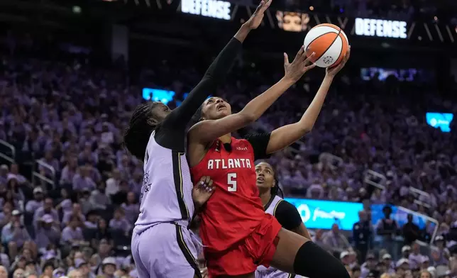 Atlanta Dream forward Angel Reese (5) shoots against Golden State Valkyries forward Laeticia Amihere during the second half of Game 1 of the WNBA basketball finals, Saturday, Oct. 17, 2026, in San Francisco. (AP Photo/Jeff Chiu)