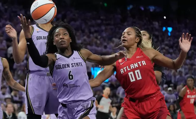 Golden State Valkyries guard-forward Kaila Charles (6) reaches for a rebound against Atlanta Dream forward Naz Hillmon (00) during the second half of Game 1 of the WNBA basketball finals, Saturday, Oct. 17, 2026, in San Francisco. (AP Photo/Jeff Chiu)