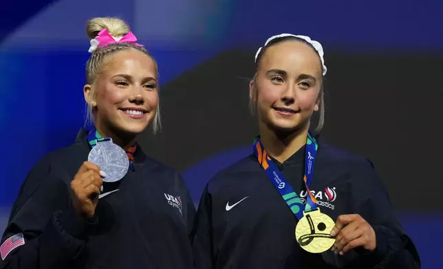 Silver medalist Reese Esponda, left, and gold medalist Claire Pease, both of the United States, pose on the podium of the floor exercise during the apparatus finals at the Artistic Gymnastics World Championships in Rotterdam, the Netherlands, Sunday, Oct. 25, 2026. (AP Photo/Patrick Post)