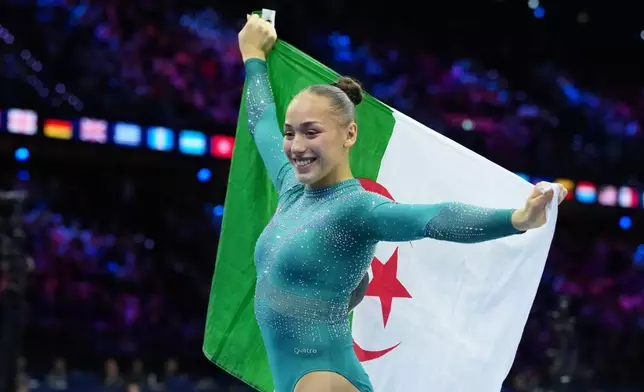 Kaylia Nemour, of Algeria, poses after winning the gold medal in the beam during the apparatus finals at the Artistic Gymnastics World Championships in Rotterdam, the Netherlands, Sunday, Oct. 25, 2026. (AP Photo/Patrick Post)
