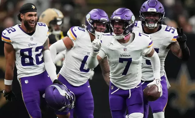 Minnesota Vikings cornerback Byron Murphy Jr. (7) celebrates with teammates after intercepting a pass against the New Orleans Saints during the second half of an NFL football game in New Orleans, Sunday, Oct. 11, 2026. (AP Photo/Matthew Hinton)