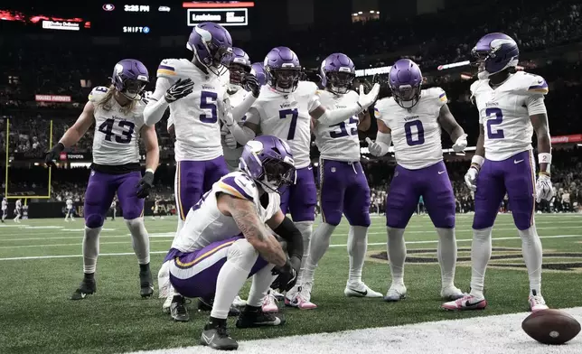 Minnesota Vikings cornerback Byron Murphy Jr. (7) celebrates with teammates after intercepting a pass against the New Orleans Saints during the second half of an NFL football game in New Orleans, Sunday, Oct. 11, 2026. (AP Photo/Matthew Hinton)