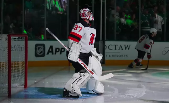 New Jersey Devils goaltender Connor Hellebuyck takes the ice prior to an NHL hockey game against the New Jersey Devils, Tuesday, Oct. 27, 2026, in Dallas. (AP Photo/Julio Cortez)