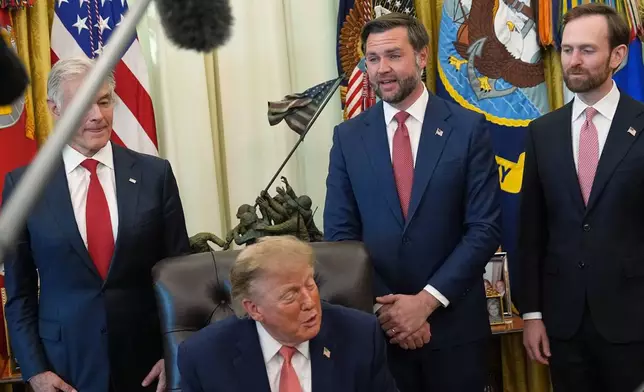 President Donald Trump speaks in the Oval Office of the White House, Tuesday, Oct. 20, 2026, in Washington, as Centers for Medicare & Medicaid Services administrator Dr. Mehmet Oz, Vice President JD Vance and Andrew Ferguson, chairman of the Federal Trade Commission listen. (AP Photo/Jacquelyn Martin)