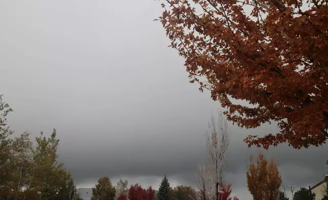 The skies are gray as a storm dumped heavy rain and hail across Flagstaff, Ariz., on Wednesday, Oct. 21, 2026. (AP Photo/Cheyanne Mumphrey)
