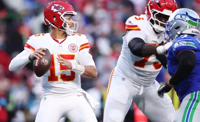Kansas City Chiefs quarterback Patrick Mahomes looks to throw during the first half of an NFL football game against the Seattle Seahawks in Seattle, Sunday, Oct. 25, 2026. (AP Photo/Kevin Ng)