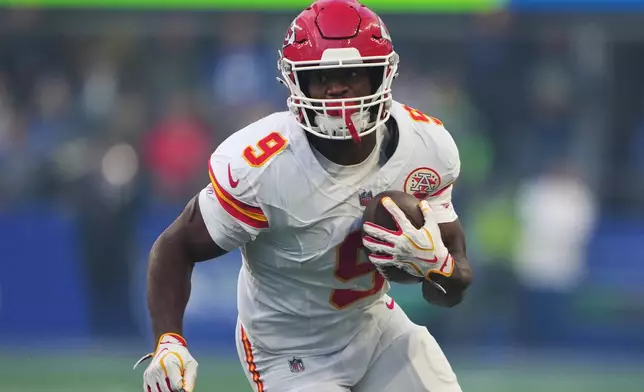 Kansas City Chiefs running back Kenneth Walker III runs the ball during the first half of an NFL football game against the Seattle Seahawks in Seattle, Sunday, Oct. 25, 2026. (AP Photo/Lindsey Wasson)