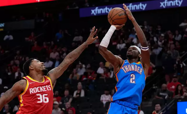 Oklahoma City Thunder guard Shai Gilgeous-Alexander (2) looks to shoot over Houston Rockets guard Marcus Smart (36) during the first quarter of a preseason NBA basketball game Thursday, Oct. 15, 2026, in Houston. (AP Photo/Kevin M. Cox)
