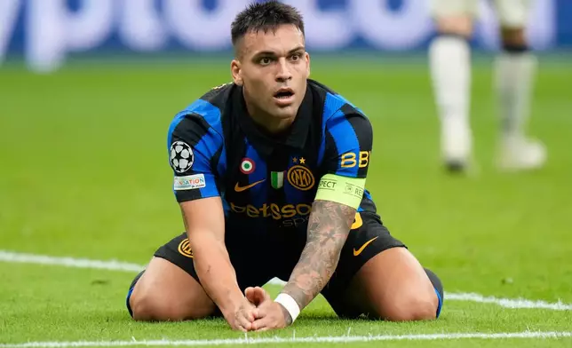 Inter Milan's Lautaro Martinez reacts after missing a scoring chance during the Champions League opening phase soccer match between Inter Milan and Club Brugge in Milan, Italy, Tuesday, Oct. 13, 2026. (AP Photo/Luca Bruno)